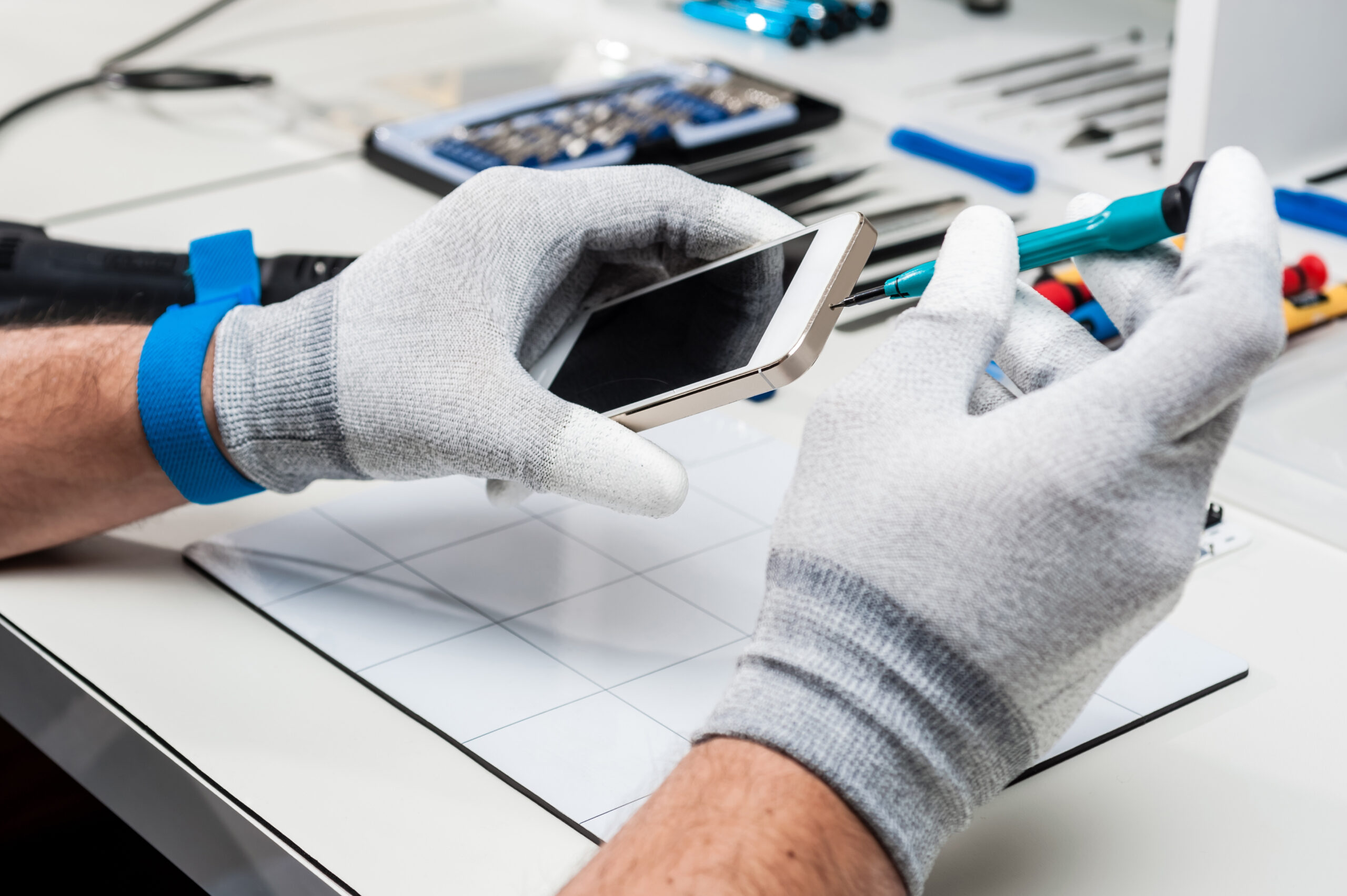 Close-up photos showing process of mobile phone repair